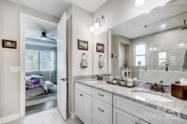 bathroom with ensuite bathroom, a wealth of natural light, and a sink