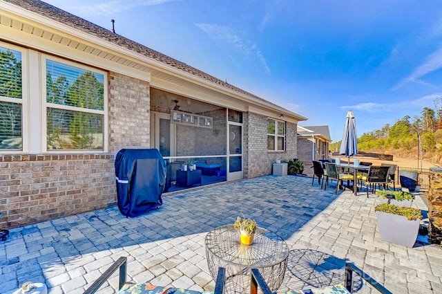 view of patio with outdoor dining space and grilling area