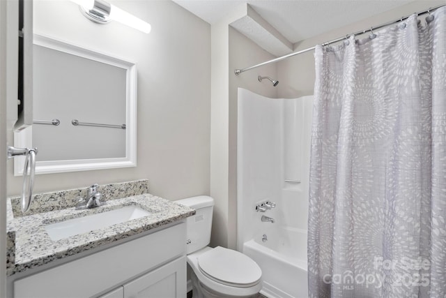 full bathroom with vanity, toilet, shower / tub combo, and a textured ceiling