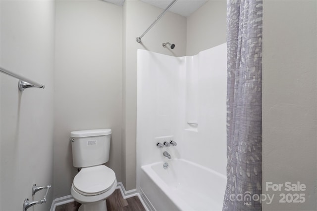 bathroom with toilet, shower / tub combo with curtain, and wood-type flooring