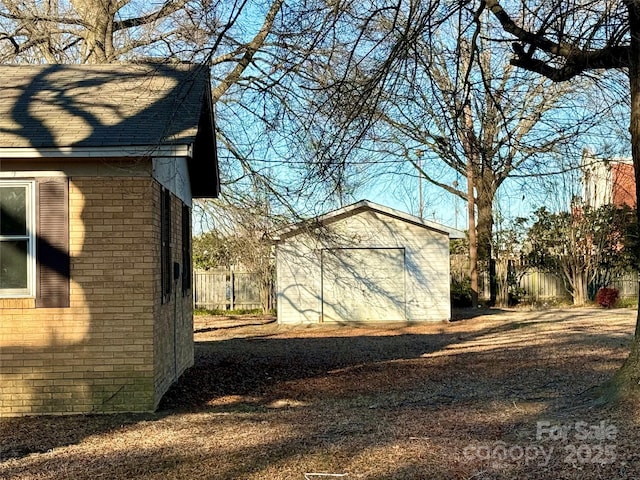 view of side of home featuring a storage unit