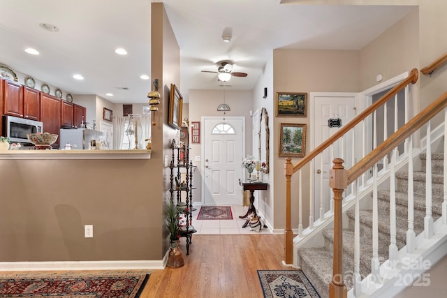 entryway featuring ceiling fan and light hardwood / wood-style flooring