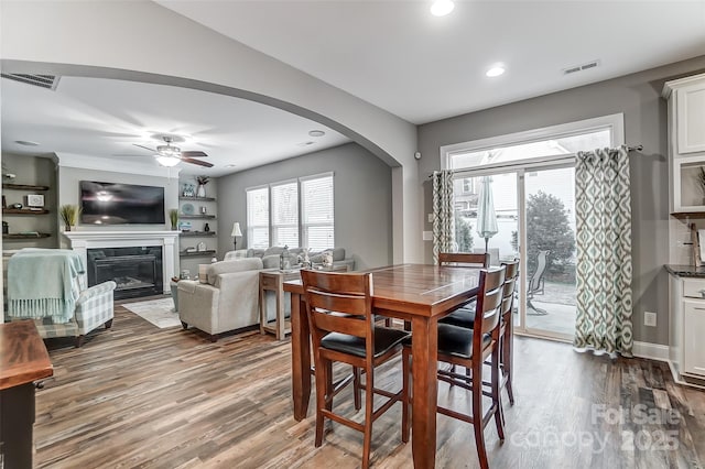 dining room with ceiling fan and hardwood / wood-style floors