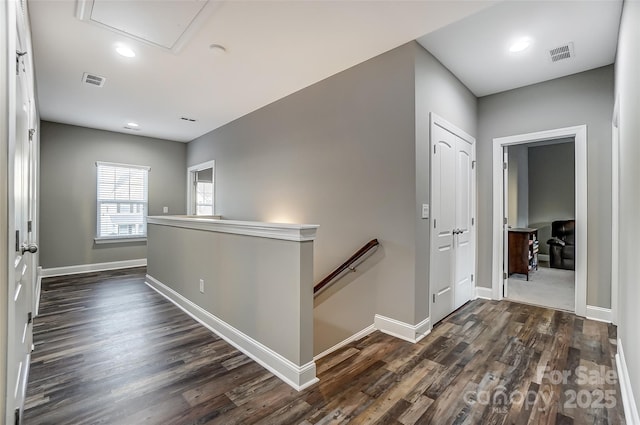 corridor with dark hardwood / wood-style floors