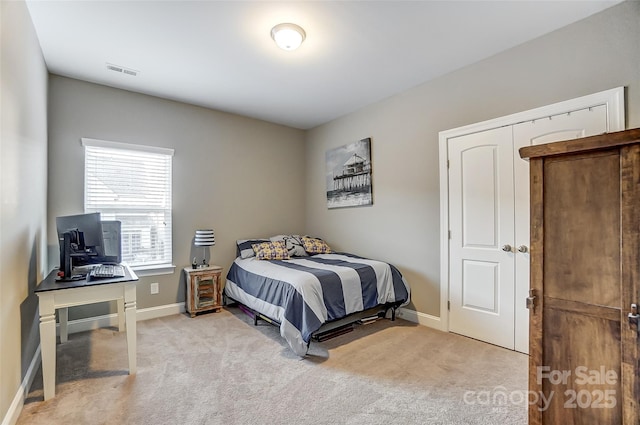 bedroom with light carpet