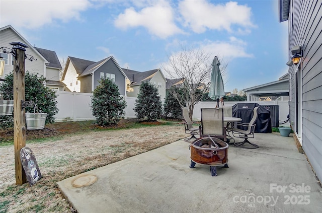 view of patio / terrace with an outdoor fire pit