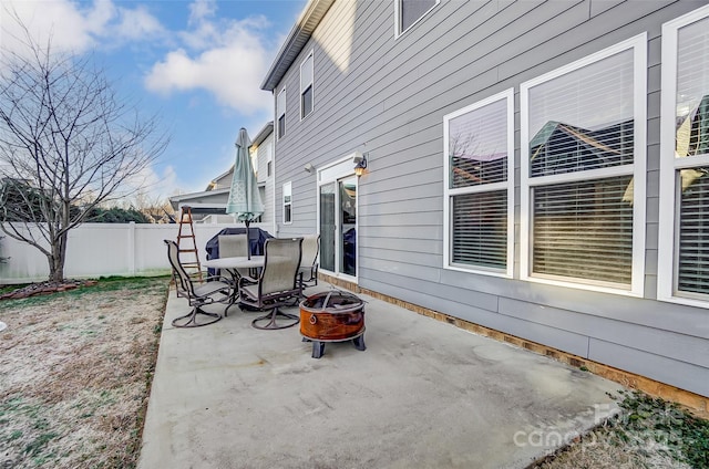 view of patio / terrace featuring an outdoor fire pit