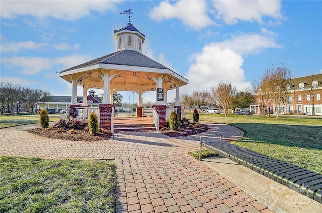 surrounding community featuring a gazebo and a yard