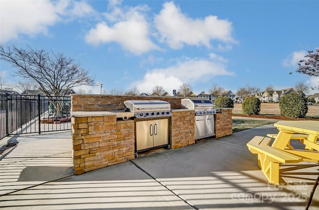 view of patio featuring a grill and exterior kitchen