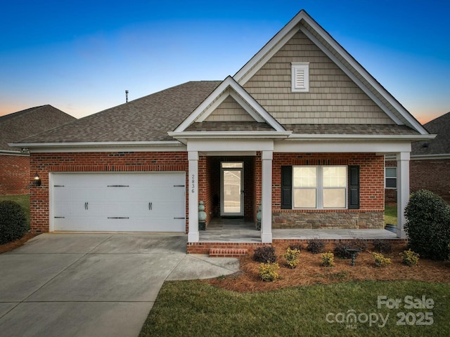 view of front of property with a garage