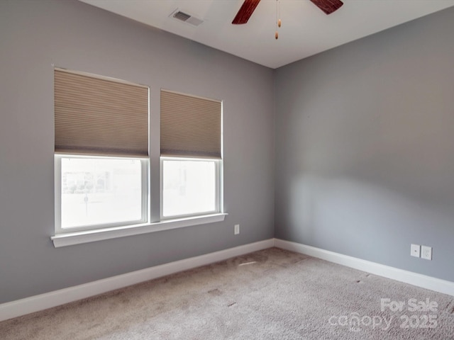 empty room featuring light carpet and ceiling fan