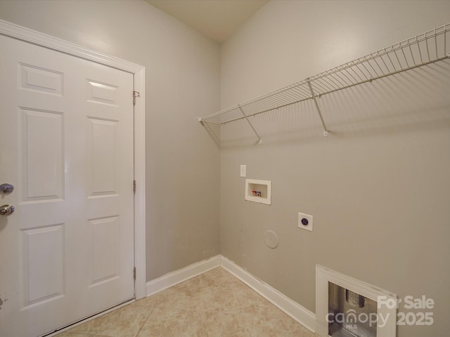 washroom with electric dryer hookup, hookup for a gas dryer, hookup for a washing machine, and tile patterned floors