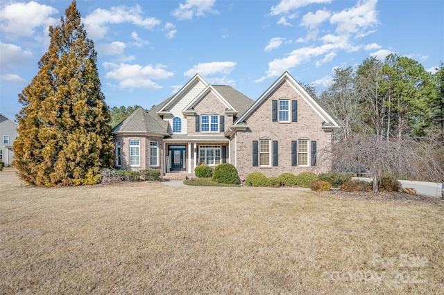 craftsman-style home featuring a front yard