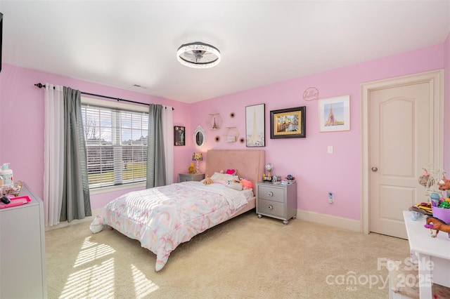 bedroom with light colored carpet