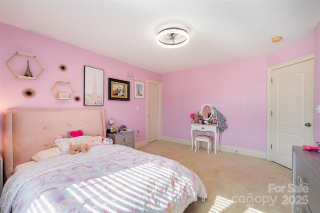 bedroom featuring light carpet