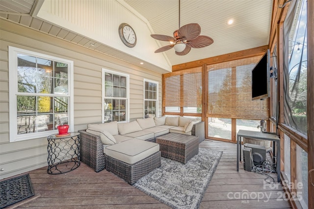 sunroom / solarium featuring vaulted ceiling and ceiling fan