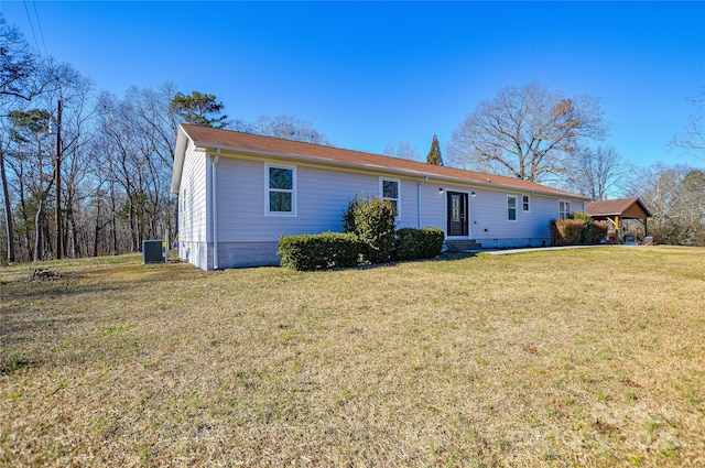 ranch-style house featuring central AC and a front lawn