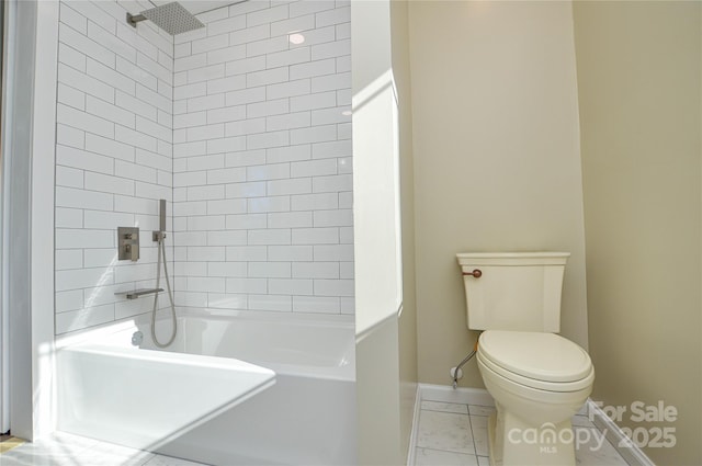 bathroom featuring toilet and tiled shower / bath combo