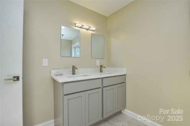 bathroom with vanity and tile patterned floors