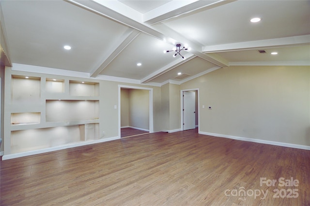 unfurnished living room with vaulted ceiling with beams and wood-type flooring