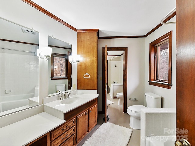 bathroom featuring vanity, crown molding, and toilet