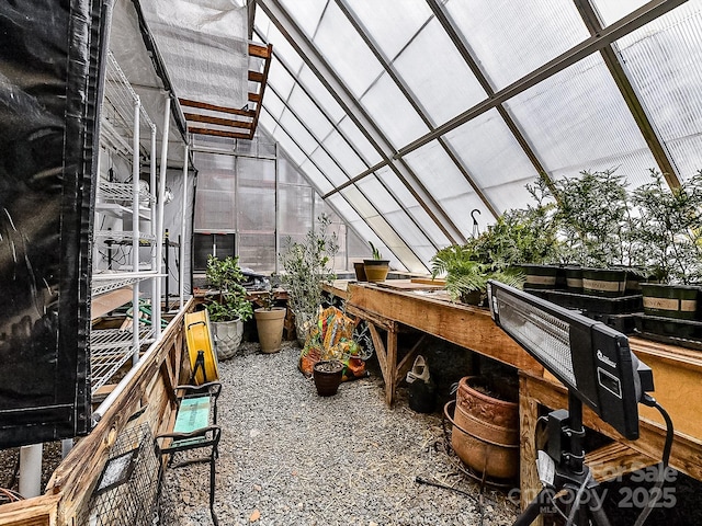 sunroom featuring lofted ceiling