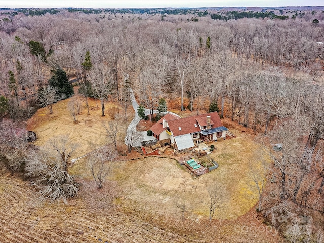 birds eye view of property with a rural view