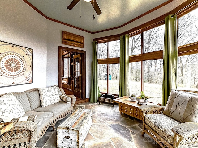 sunroom with ceiling fan