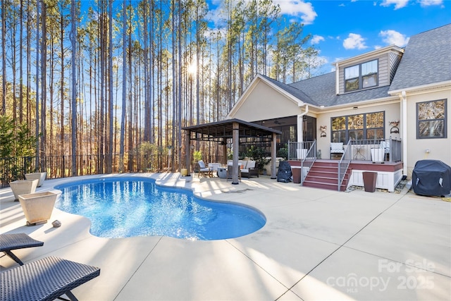 view of pool with area for grilling, outdoor lounge area, a patio area, a gazebo, and a jacuzzi