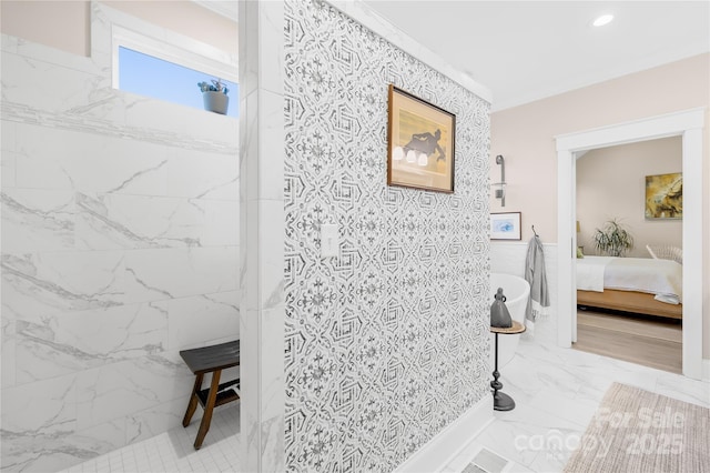 bathroom featuring ornamental molding and walk in shower