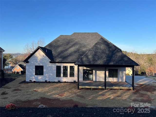 back of property featuring a porch