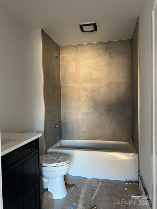 full bathroom with vanity, toilet, and tiled shower / bath combo