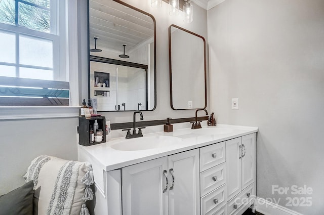 bathroom featuring vanity and ornamental molding