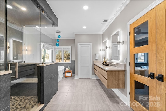 bathroom with vanity, shower with separate bathtub, crown molding, and tile patterned flooring