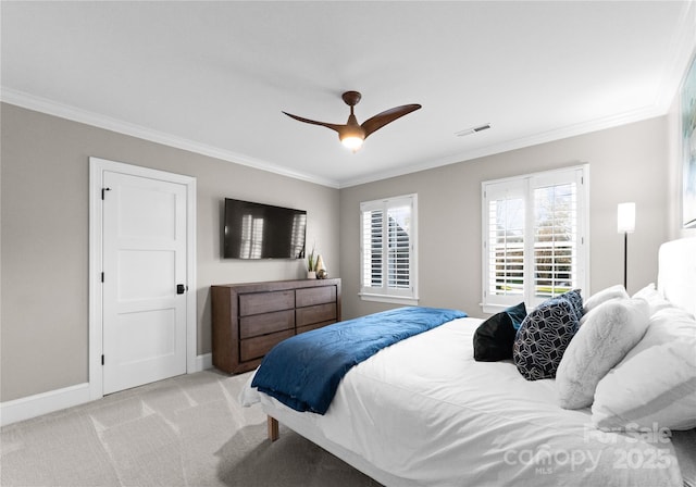 bedroom with ceiling fan, ornamental molding, and light carpet