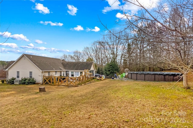 view of yard featuring a pool side deck