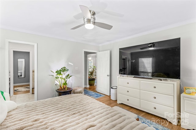 bedroom featuring crown molding, ceiling fan, and light hardwood / wood-style floors