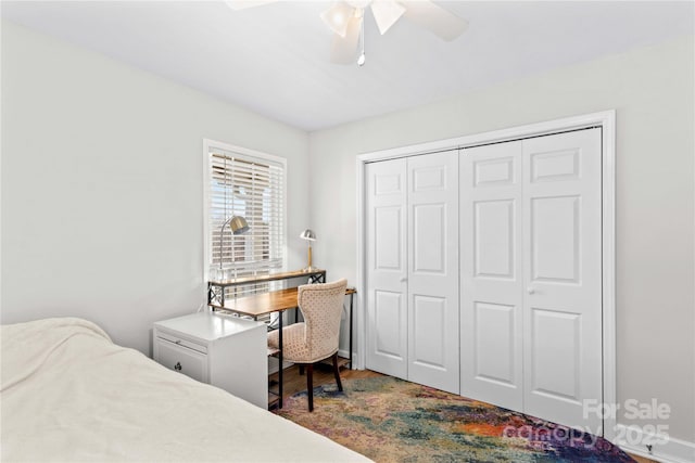 bedroom with hardwood / wood-style flooring, ceiling fan, and a closet