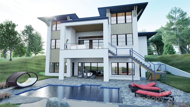 rear view of property with a balcony, a yard, and a patio area