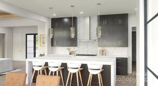 kitchen featuring pendant lighting, a kitchen breakfast bar, tasteful backsplash, and wall chimney range hood