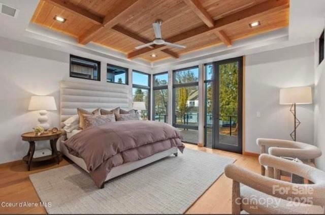 bedroom with wood ceiling, light hardwood / wood-style flooring, ceiling fan, access to exterior, and expansive windows