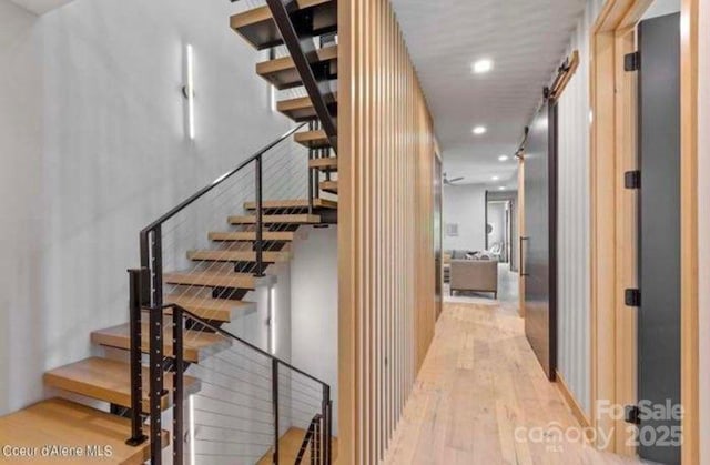 stairway featuring wood-type flooring