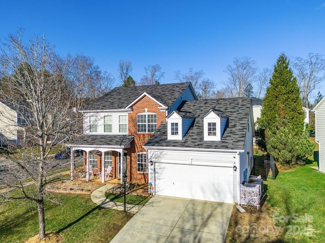 view of front of property featuring a front lawn and a porch