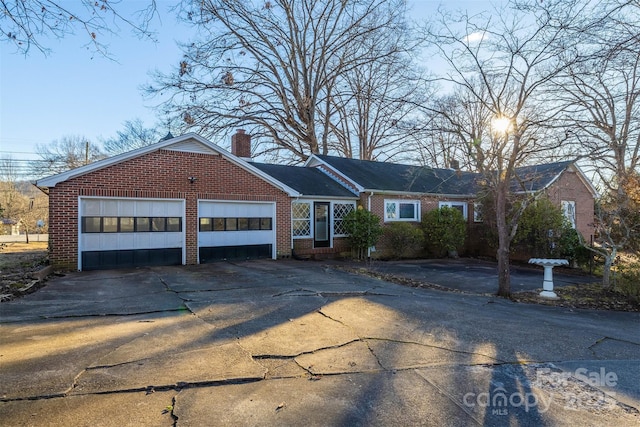 ranch-style home with a garage