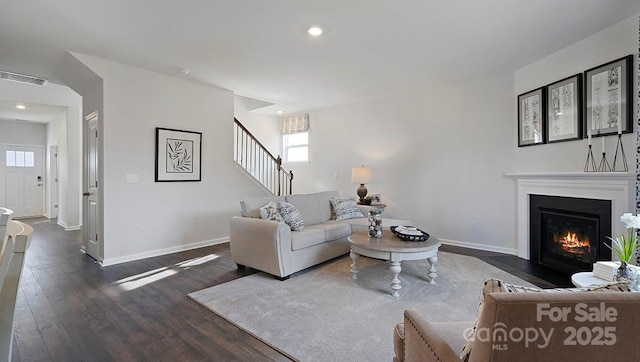 living room featuring dark wood-type flooring