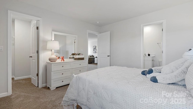 bedroom featuring light colored carpet and connected bathroom