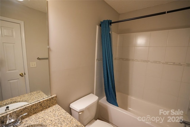 full bathroom featuring vanity, toilet, a textured ceiling, and shower / bath combo