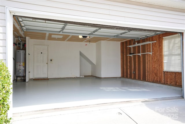 garage featuring a garage door opener and water heater