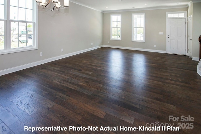 interior space with an inviting chandelier, ornamental molding, and dark hardwood / wood-style floors