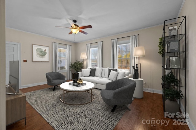 living room featuring ceiling fan, crown molding, and dark hardwood / wood-style flooring